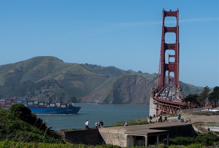 A container ship passing beneath the Golden Gate Bridge, San Francisco